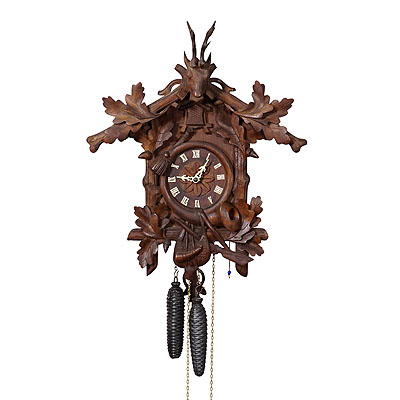 Antique Black Forest Carved Cuckoo Clock with Stag Head on Top.