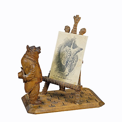 A Wooden Carved Black Forest Picture Stand with Bear.